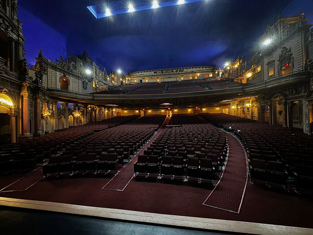 Rows of seats and ornate balconies in the Paradise auditorium