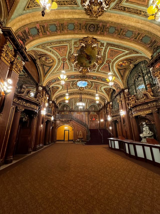 The gilded lobby and staircase inside the Paradise Theater