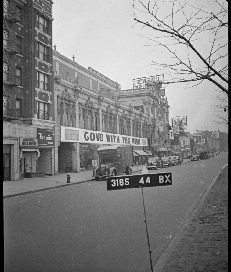 Black-and-white street photograph of the Paradise on the Grand Concourse, with Gone with the Wind across its marquee