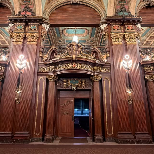 Carved doorway and gilded architectural details at Paradise