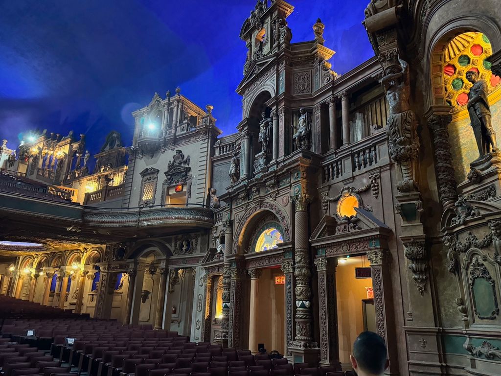 Warmly lit architectural details inside the Paradise Theater